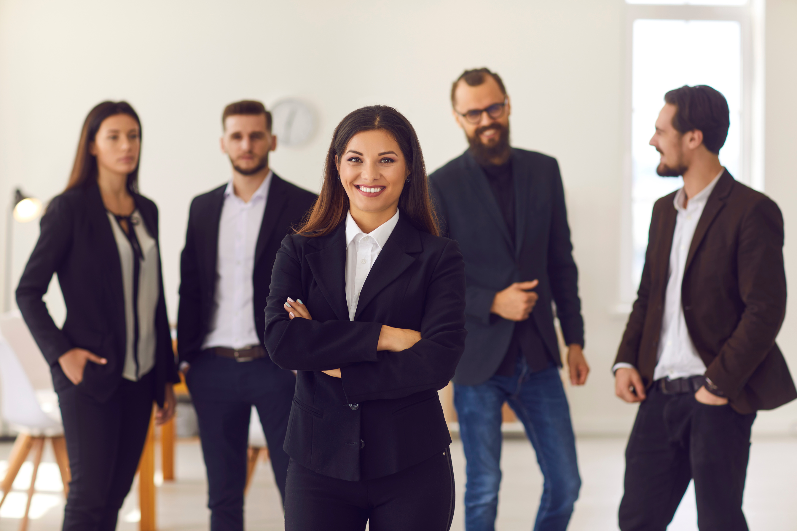 Happy Young Female Team Leader or Executive Manager Smiling and Looking at Camera